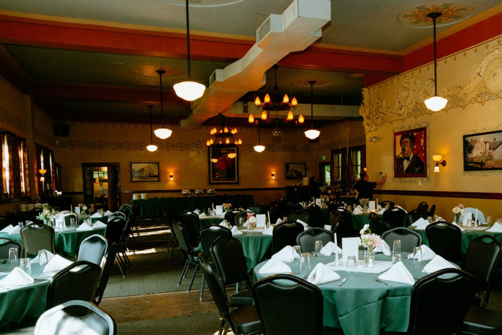 Wedding staff arranging and preparing the reception room before guests arrive
