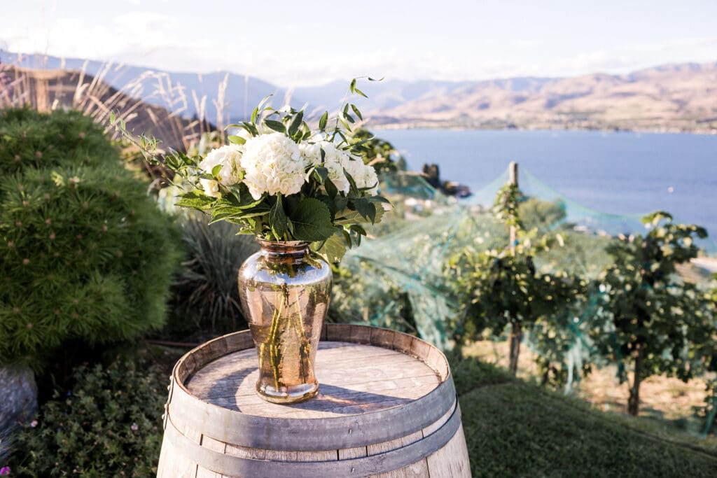Minimal floral arrangement on a wine barrel at a budget-friendly PNW elopement in the Pacific Northwest

