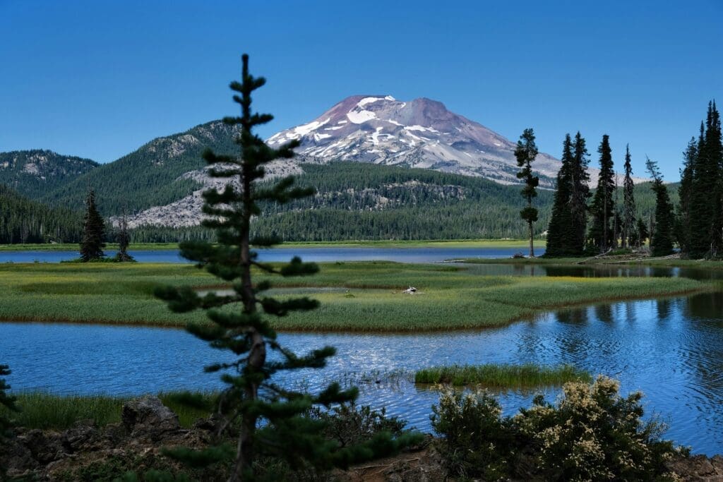Mountain view at Sparks Lake during a Bend Oregon elopement with calm water and forest surroundings