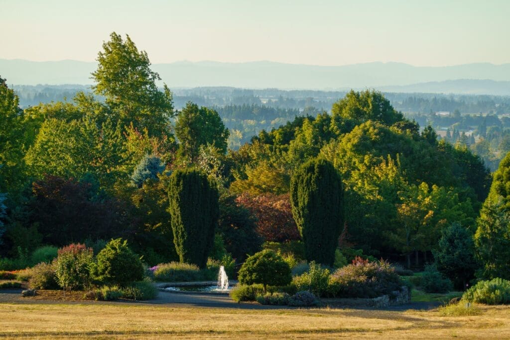 Scenic garden with fountain, mature trees, and valley views that makes a beautiful Eugene Oregon elopement location.