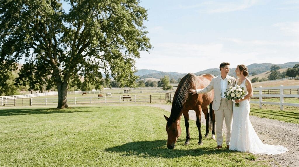 Newlyweds standing with a horse on a scenic ranch in Bend, Oregon, perfect for an intimate Central Oregon wedding.