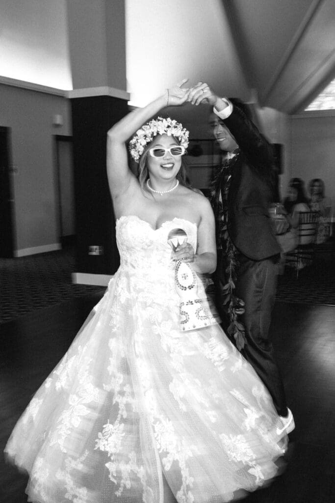 Bride in a flower crown twirls during the first dance at their Lake Oswego wedding reception