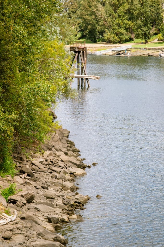 Rocky shoreline along the Willamette River at The Foundry, the riverside setting for a Lake Oswego wedding