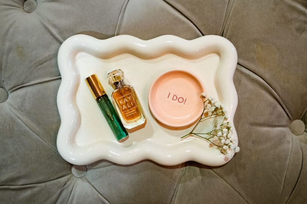 Bridal detail tray with perfume, an I Do ring dish, and baby's breath at The Foundry in Lake Oswego