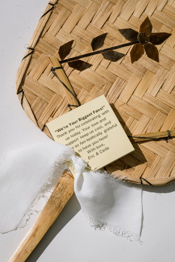 Woven fan wedding favor with a thank-you card from Eric and Carla at their Lake Oswego wedding