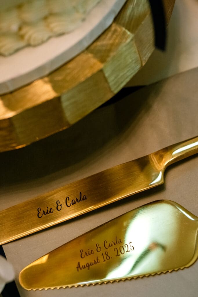 Gold cake knife and server engraved Eric and Carla, August 18, 2025 at their Lake Oswego wedding