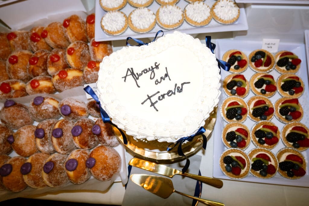 Always and Forever heart cake with donuts and fruit tarts on the dessert table at The Foundry in Lake Oswego