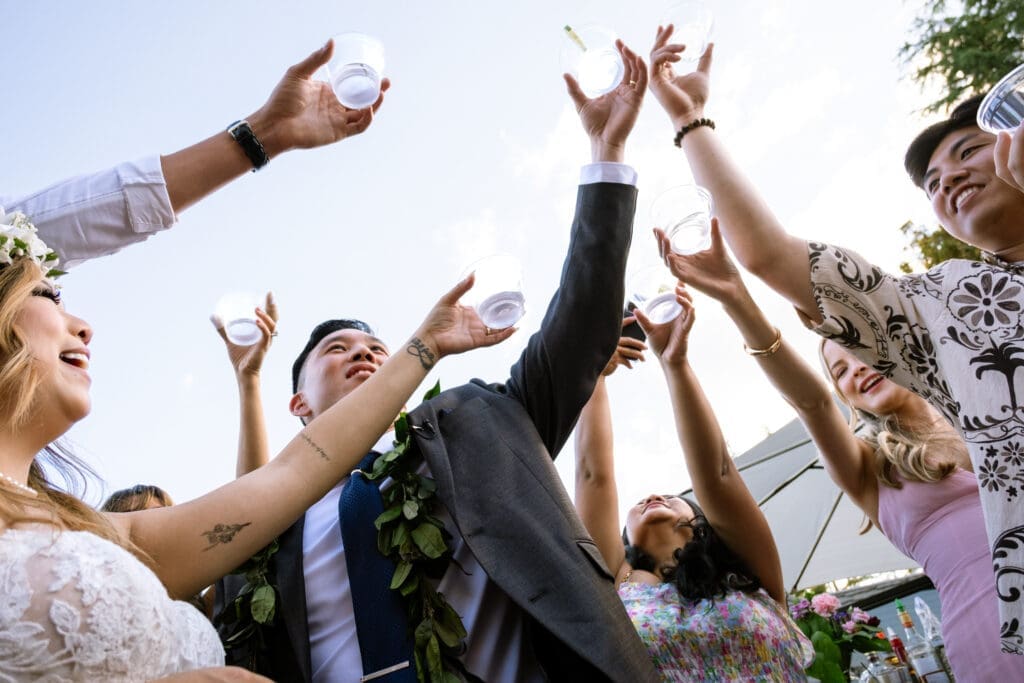 Guests raise cups for a celebratory toast with the couple at The Foundry near Portland