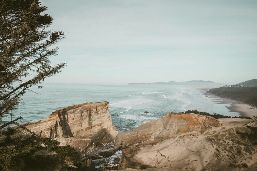 View of Cape Kiwanda’s sandstone cliffs and Pacific Ocean shoreline in Pacific City, Oregon
